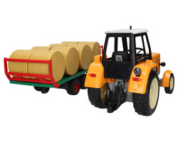 Traktor zabawkowy Ursus C-360 żółty + przyczepa do wywozu balotów Bruder